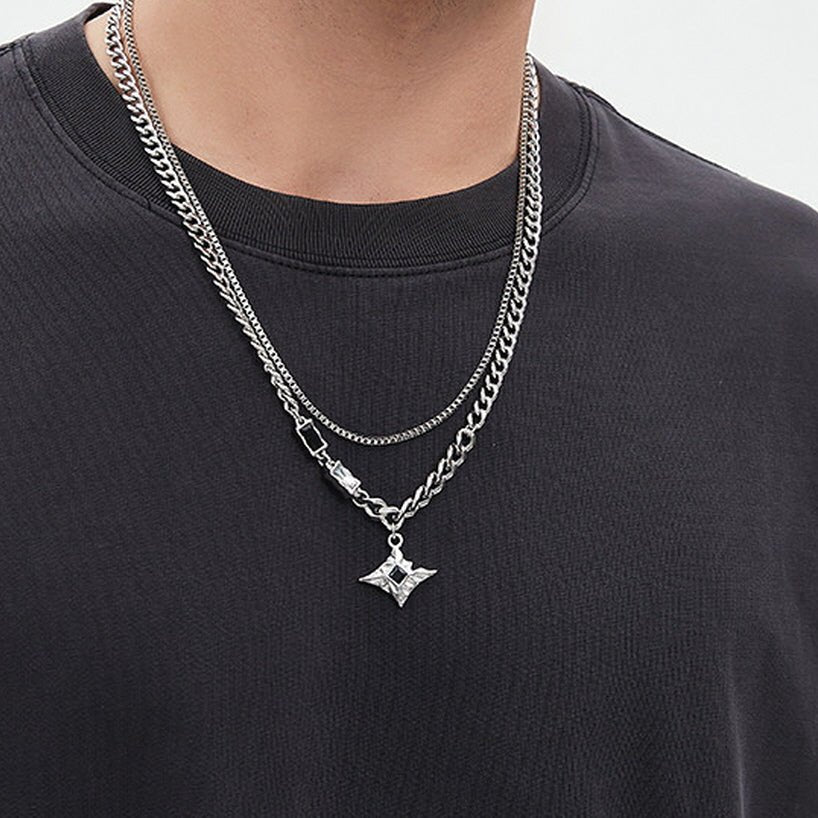 Men's Starburst Layered Necklace styled over a dark shirt for a modern layered jewelry look