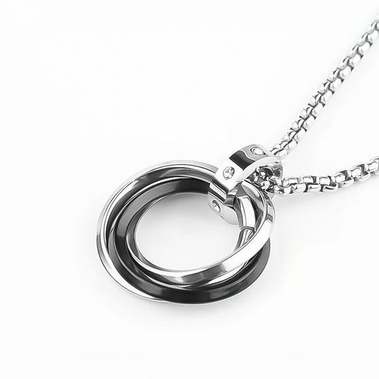 Close-up of Interlocking Ring Necklace featuring interlocking silver-tone rings and polished metal details