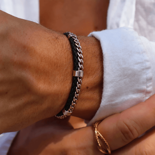 Men's Forge Leather Bracelet worn on wrist featuring black braided leather and silver-tone accents