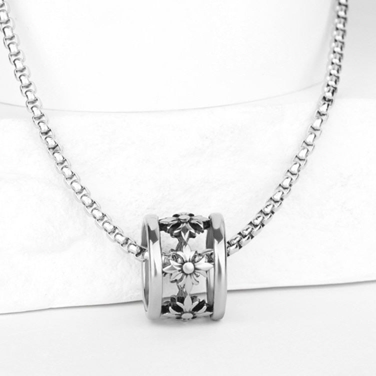Iris Bead Necklace displayed on a white jewelry stand showing its chain and decorative pendant