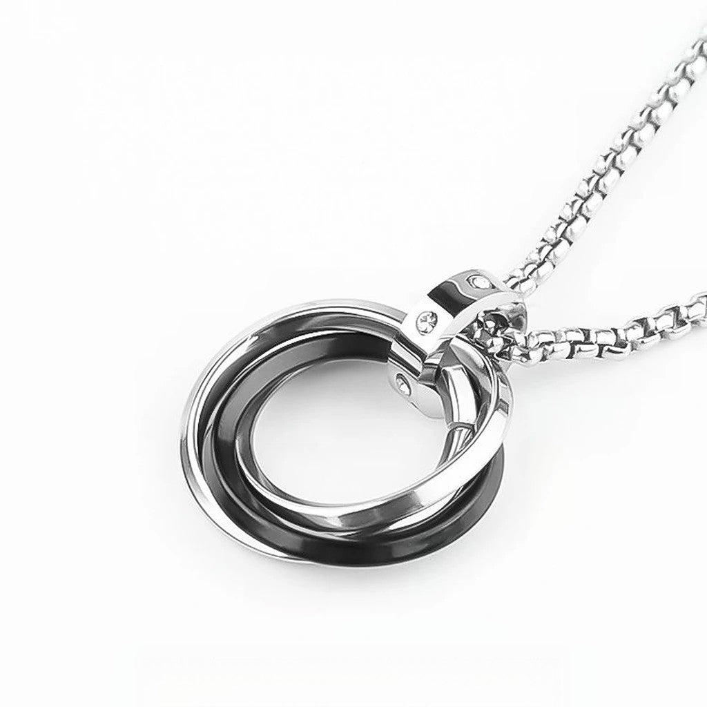 Close-up of Interlocking Ring Necklace featuring interlocking silver-tone rings and polished metal details