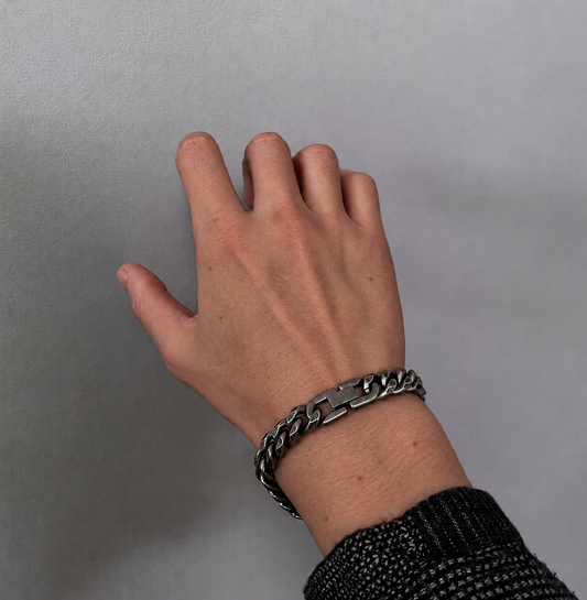 Men's Cuban Chain Bracelet worn on wrist featuring bold silver-tone interlocking chain links