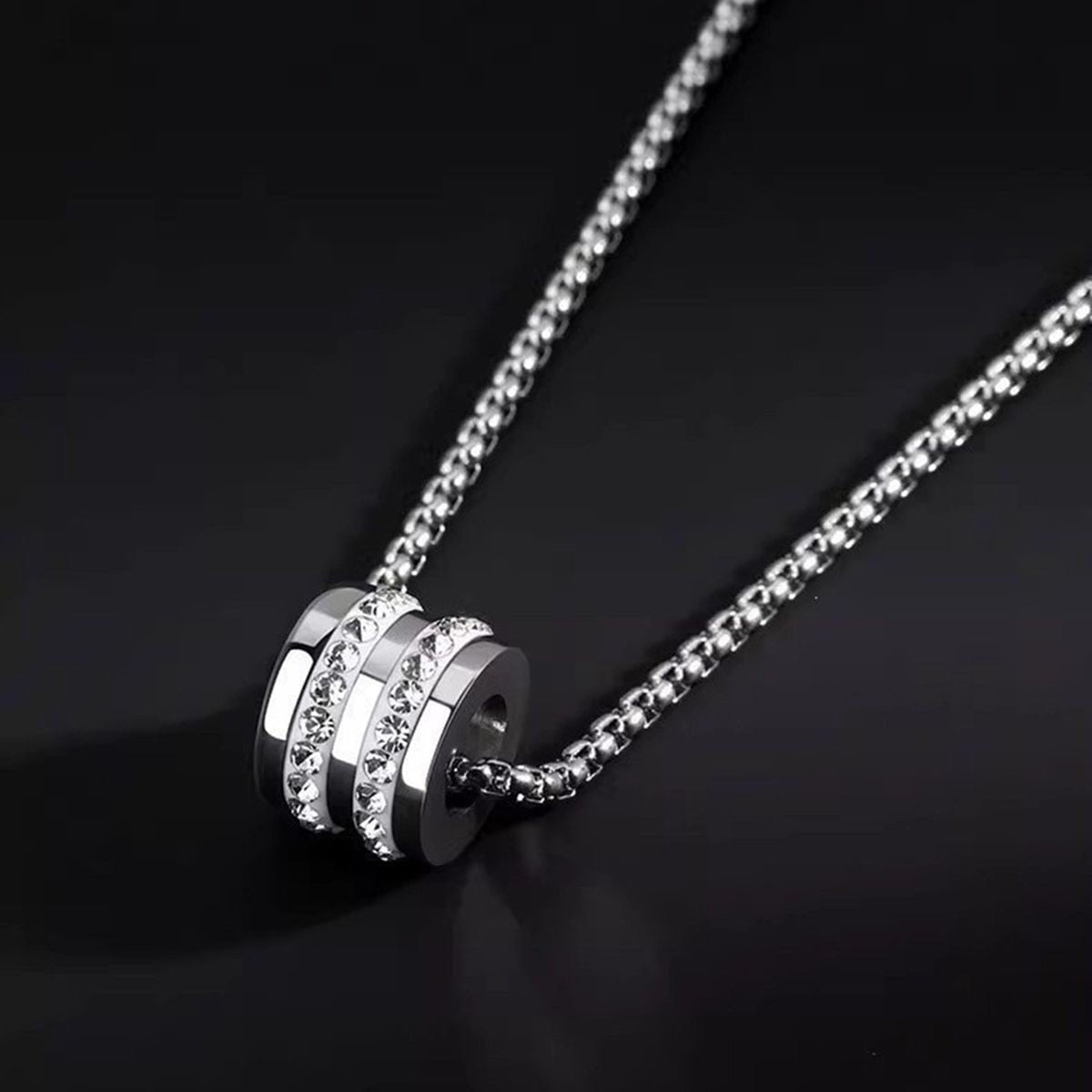 Detailed close-up of Pavé Barrel Necklace highlighting its pavé-style stone accents and polished chain