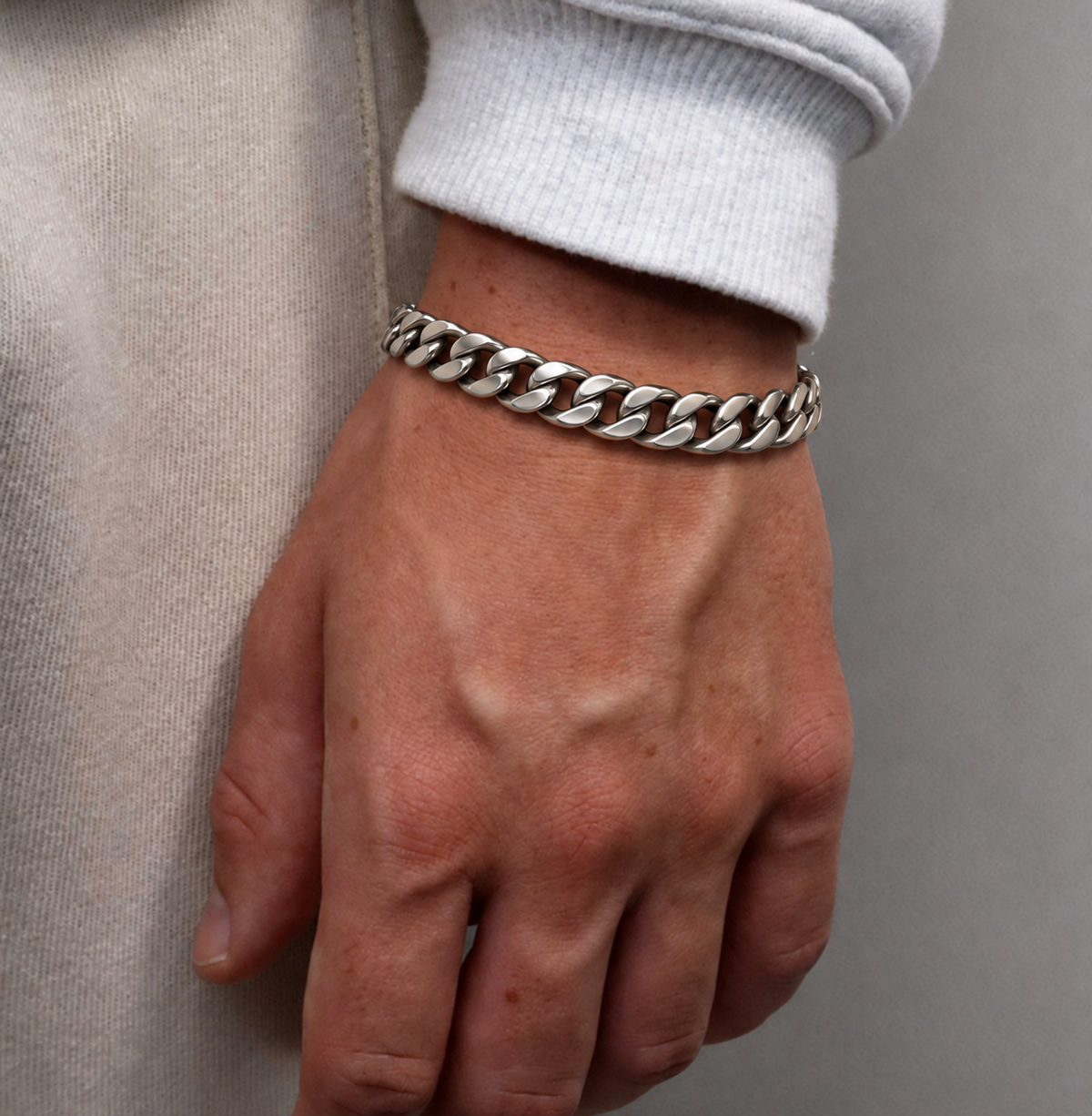 Cuban Chain Bracelet styled with a white shirt and gray jacket for a modern men's look