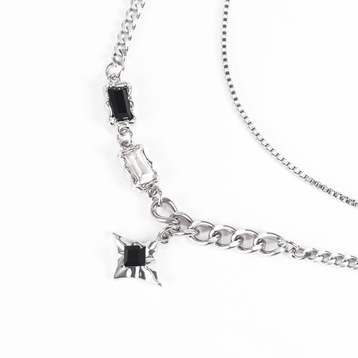 Starburst Layered Necklace featuring a detailed starburst pendant and silver-tone layered chains