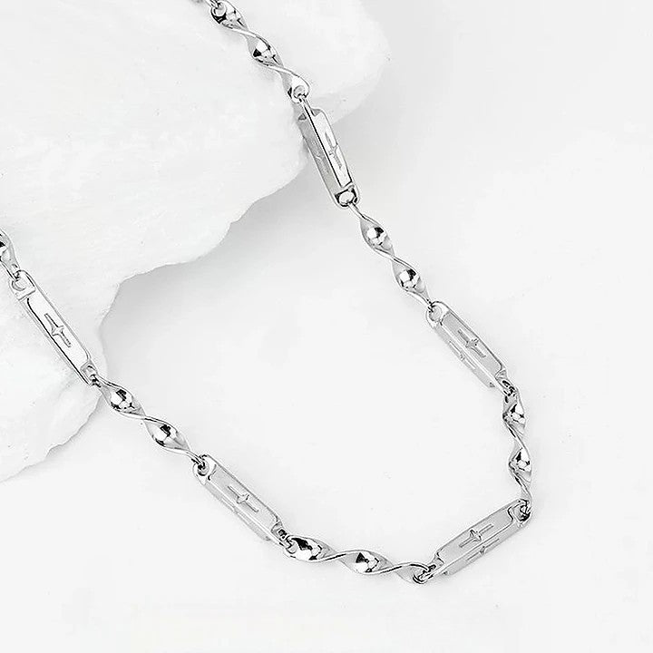 Close-up of Mobius Link Necklace featuring polished silver-tone links and chain details