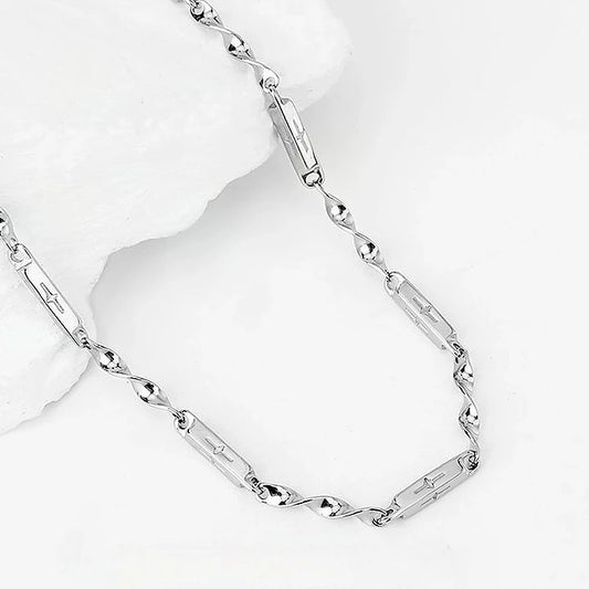 Close-up of Mobius Link Necklace featuring polished silver-tone links and chain details